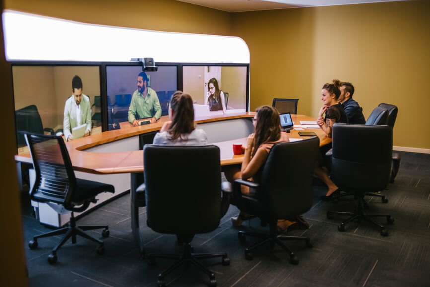 Businesspeople Video Chat in the meeting room - Stocksy