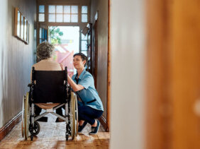 Carer with woman in wheelchair