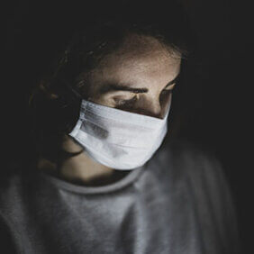 Woman in mask. Photo: Engin Akyurt, unsplash.