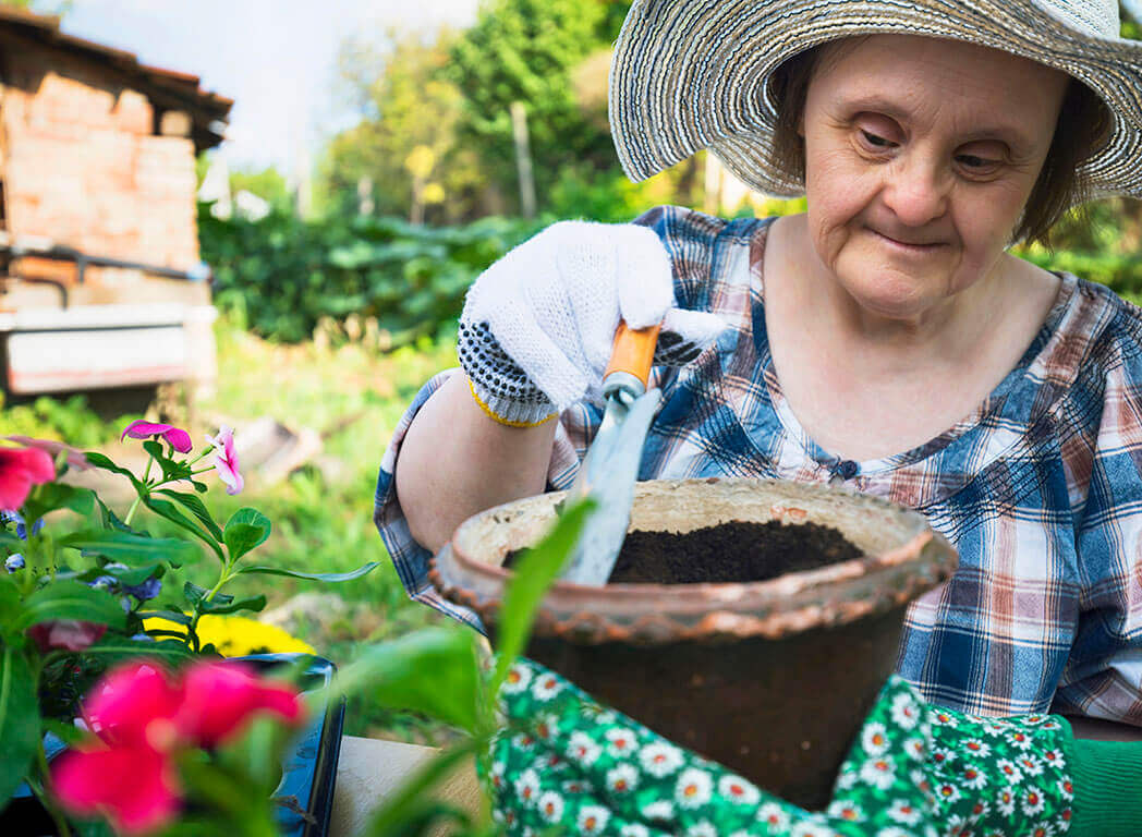 woman with Down's syndrome gardening