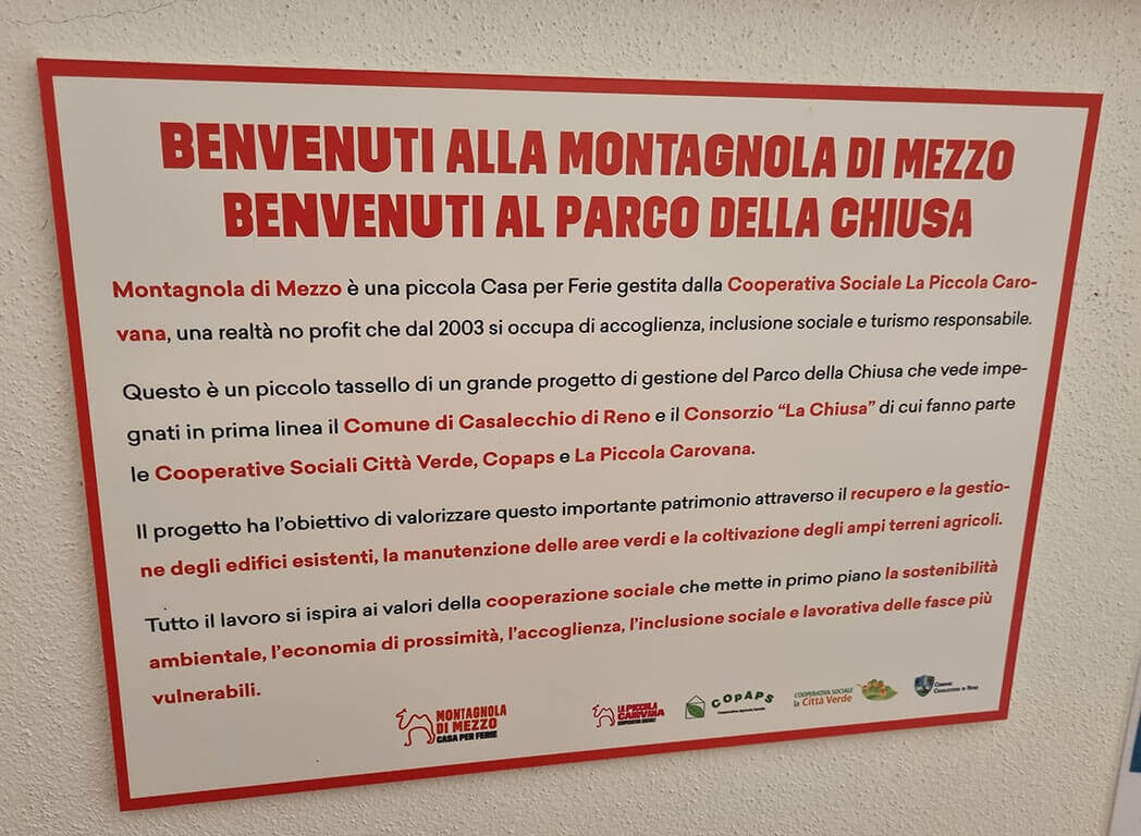 The sign at Montagnola di Mezzo explains how the historic homestead and the wider Chiusa parklands it is situated in are managed by the local council and a consortium of co-ops.