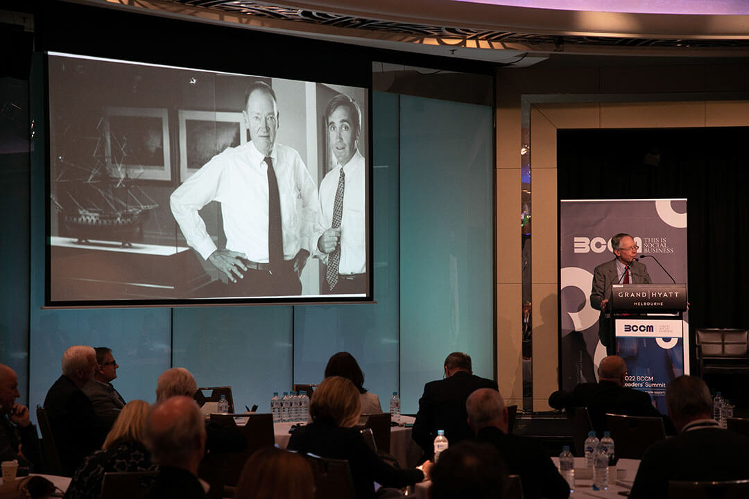 2022 BCCM Leaders Summit Jeremey Duffield with photo of him and Jack Bogle, BCCM photo by Daryl Charles