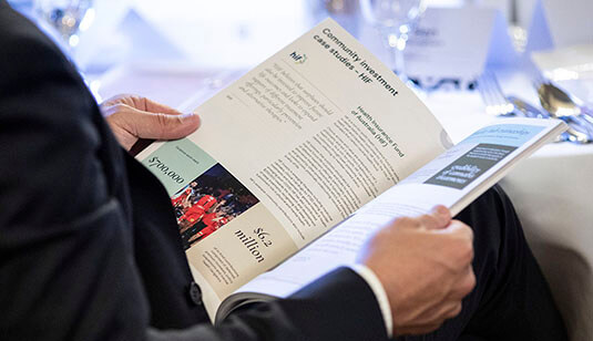 DM-BCCM member reading NME report at the CEO Summit 2022 photo by Chris Gleisner
