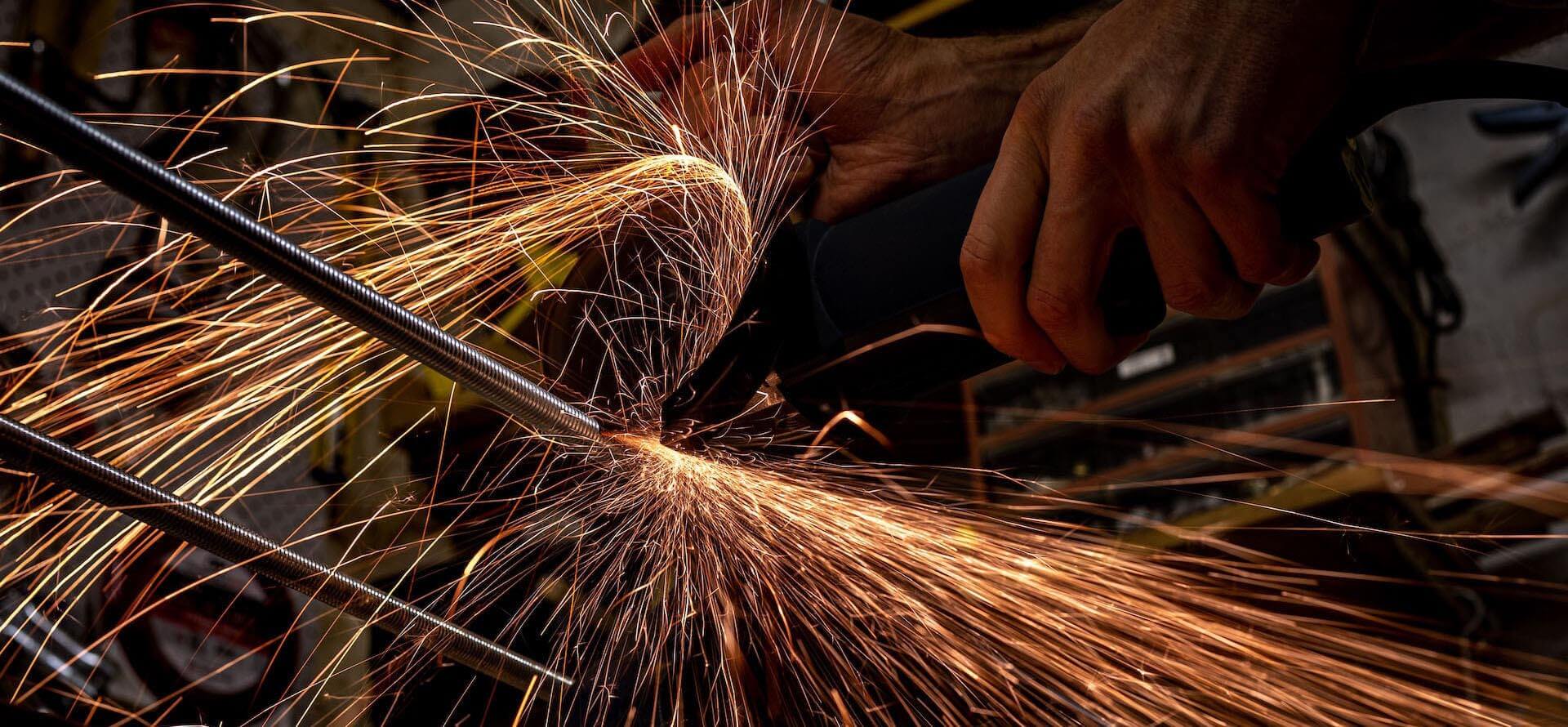 angle grinder with sparks. Photo by david gilbertson unsplash